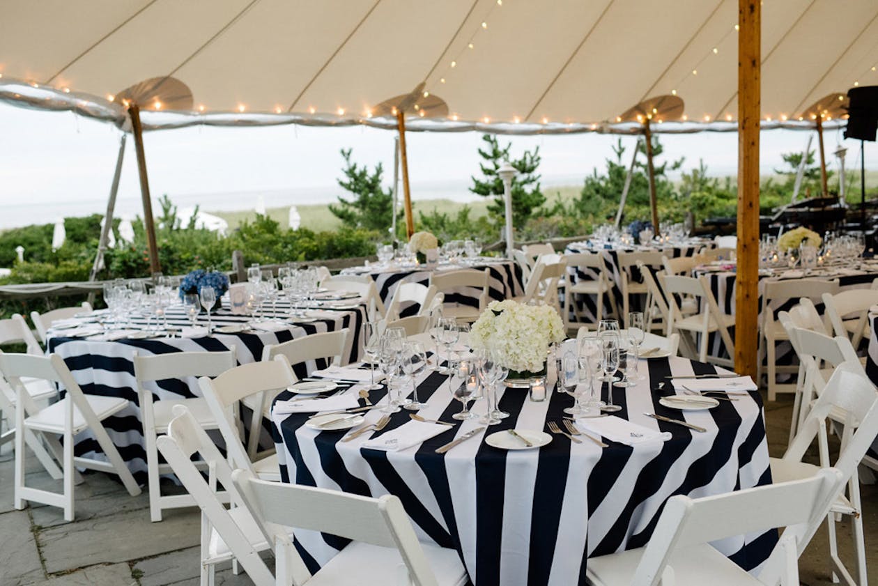 Preppy nantucket wedding with blue and white stripped reception tables | Partyslate