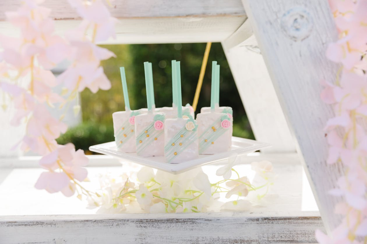 popsicles sitting on table with decorative designs on them | PartySlate