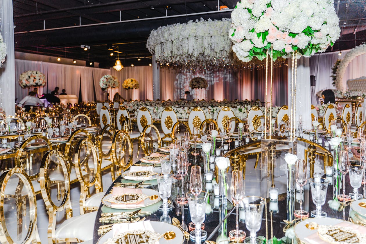 Luxurious wedding with gold and white seating | PartySlate