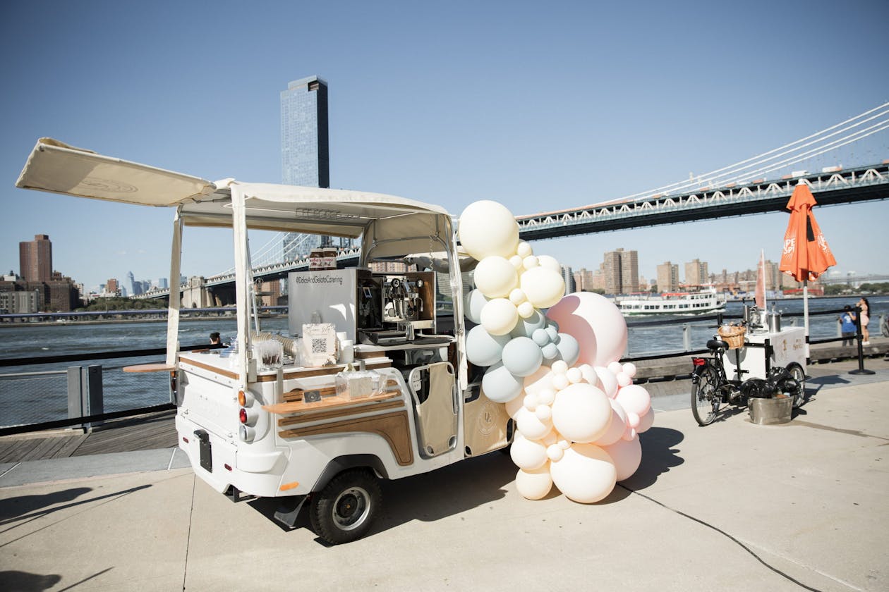 boho outdoor birthday with ice cream truck covered in balloons | PartySlate