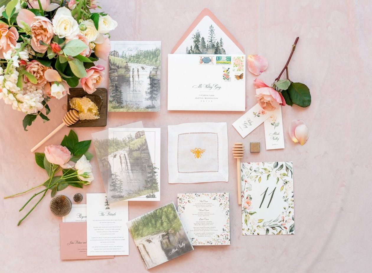 Blush wedding invitations suite with forest and waterfall graphics | PartySlate