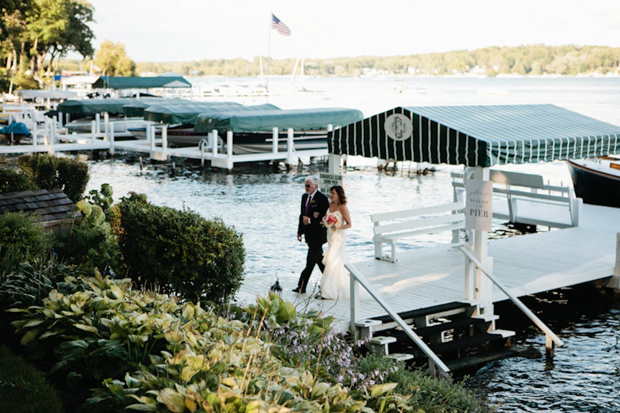 Father walks Bride off boat pier | PartySlate