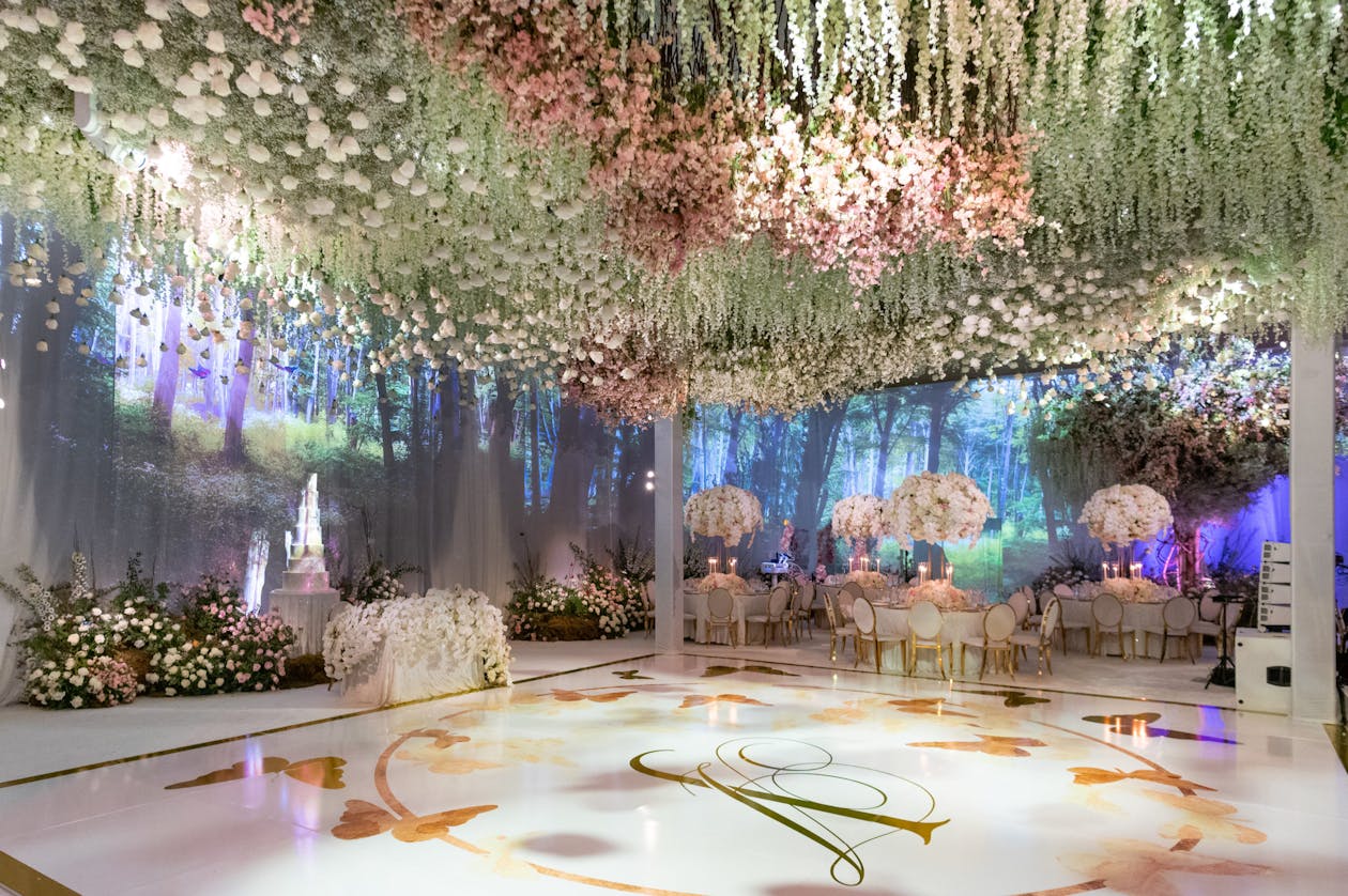 Enchanting fairytale wedding with suspended floral ceiling and forest projection mapping | PartySlate