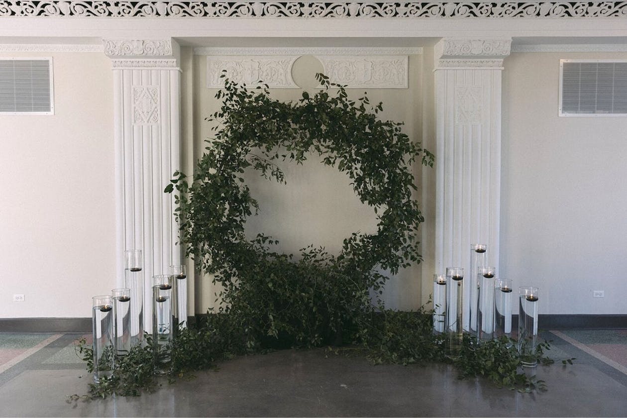 Circular greenery wedding arch | PartySlate