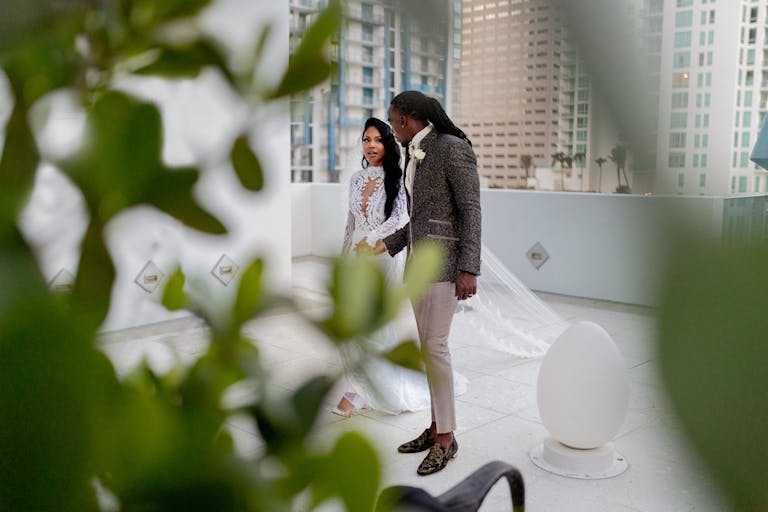 bride and groom on rooftop of miami wedding venues | PartySlate
