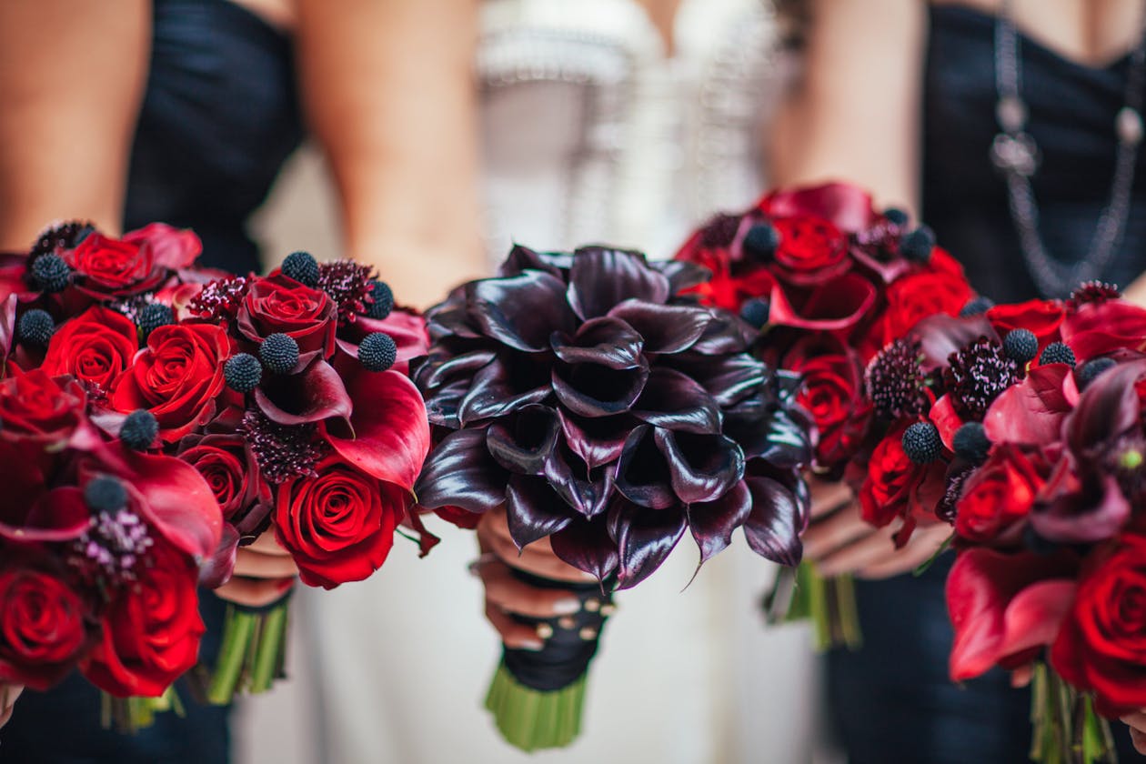 Bridal bouquets with red and black calla lilies | PartySlate