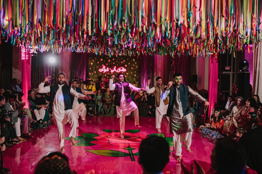 Three men perform a choreographed dance at rainbow sangeet | PartySlate