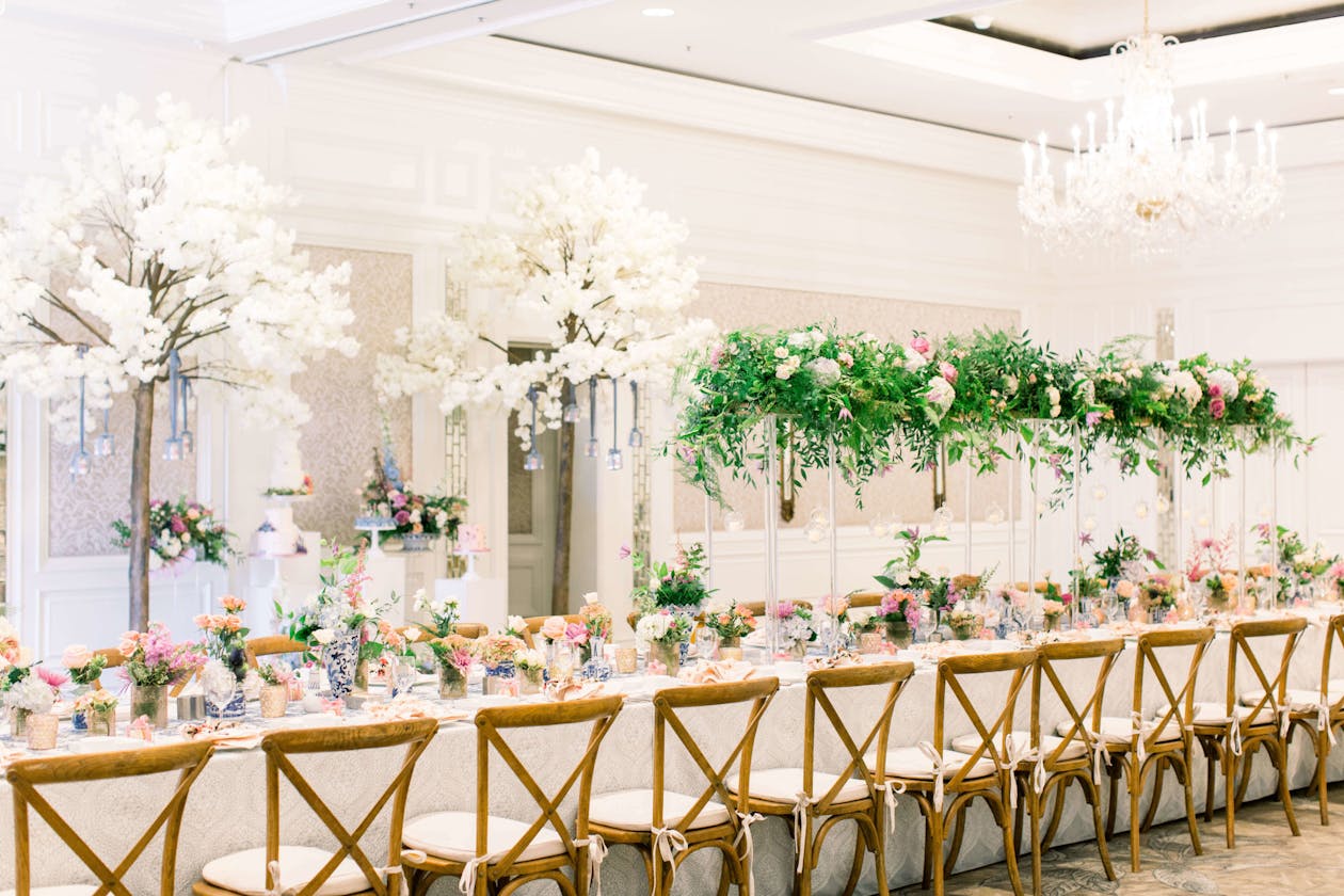 Whimsical baby shower with elevated white and green floral centerpieces | PartySlate