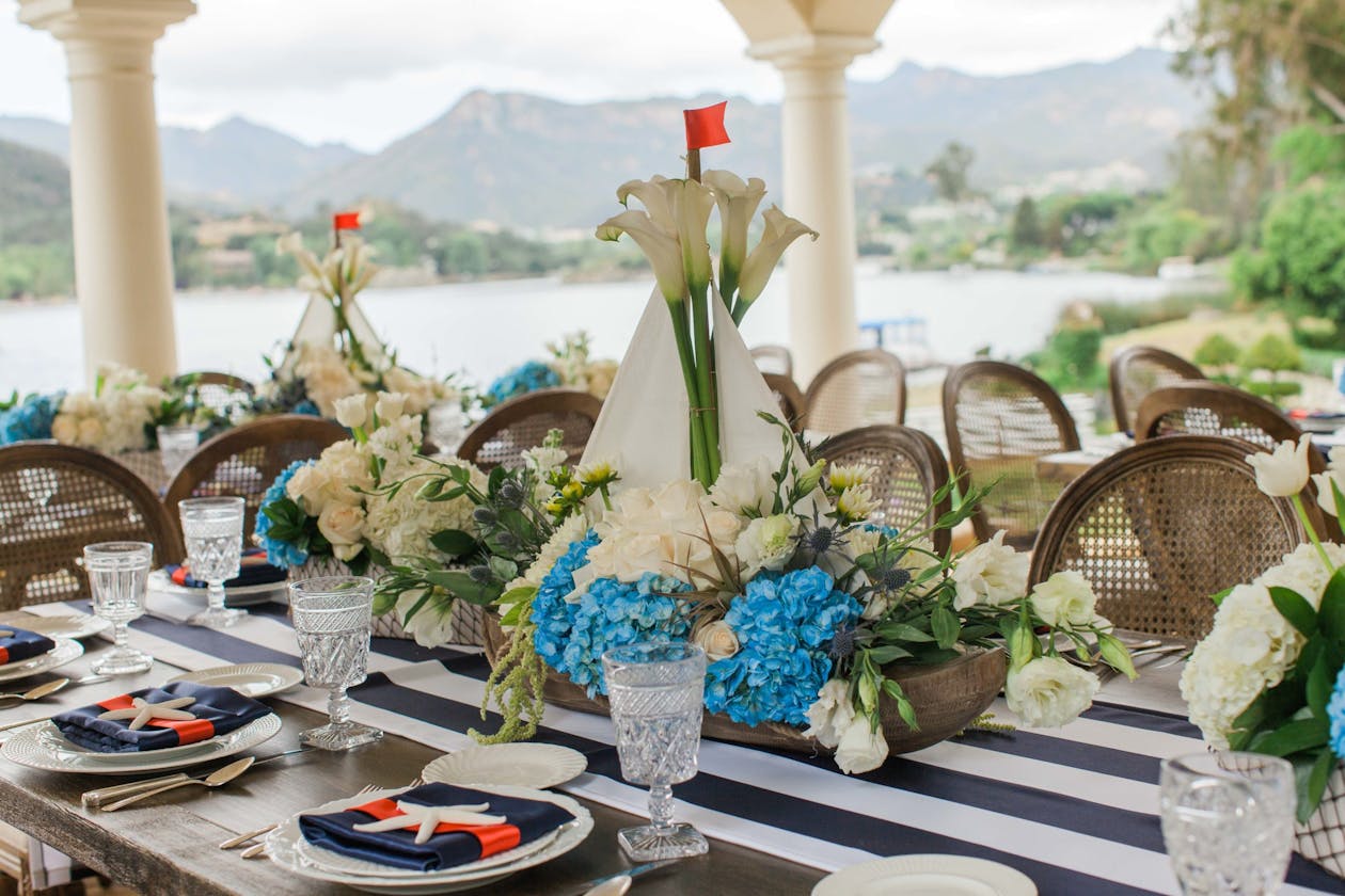 Sailboat centerpiece at nautical theme baby shower on the water | PartySlate