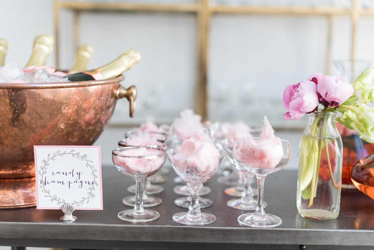 champagne bar with pink cotton candy in each cup | PartySlate