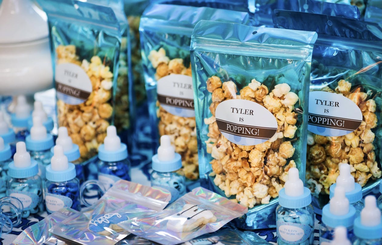 individually bagged caramel corn popcorn at baby shower in blue bags | PartySlate