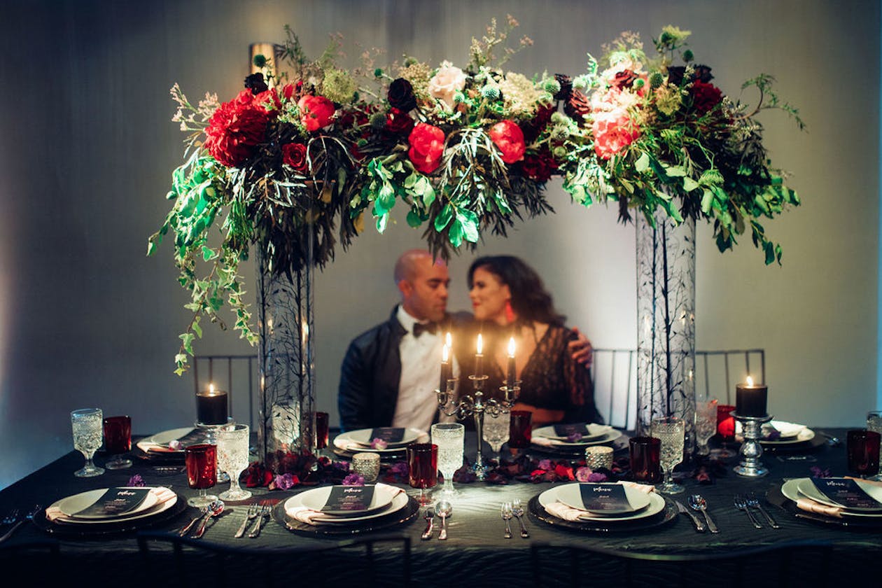 Moody wedding sweet heart table with greenery | PartySlate
