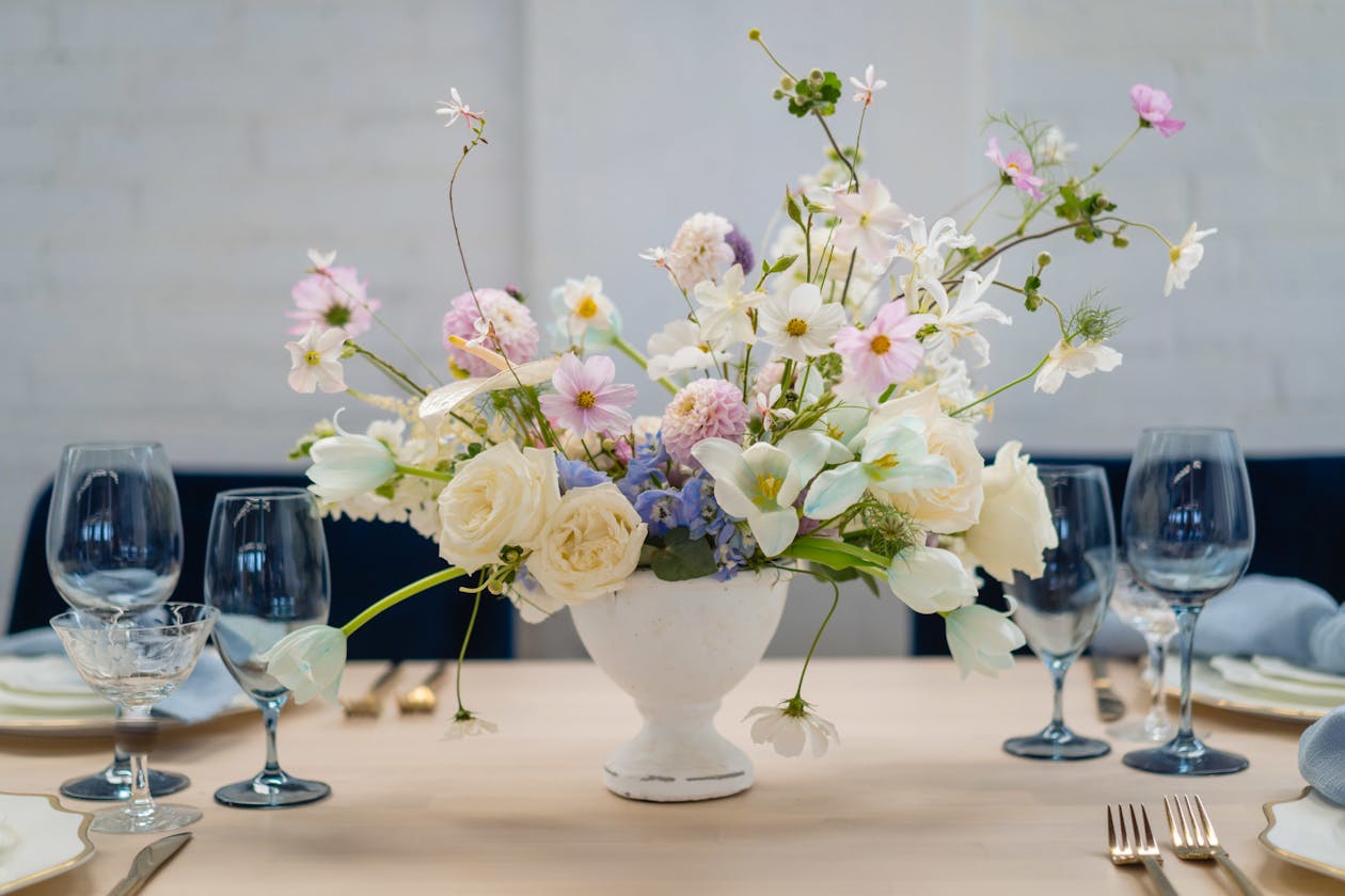 Delicate floral centerpiece in pastel shades | PartySlate