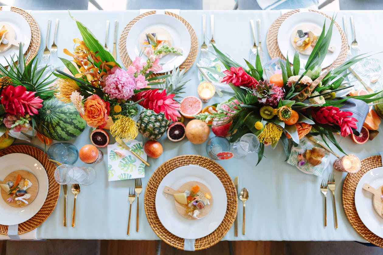 Tropical baby shower with colorful floral and fruit centerpieces | PartySlate