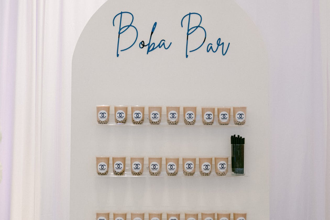 boba bar wall at 60th birthday party | PartySlate