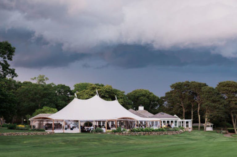 Farm Neck Golf Club outdoor tented wedding | PartySlate