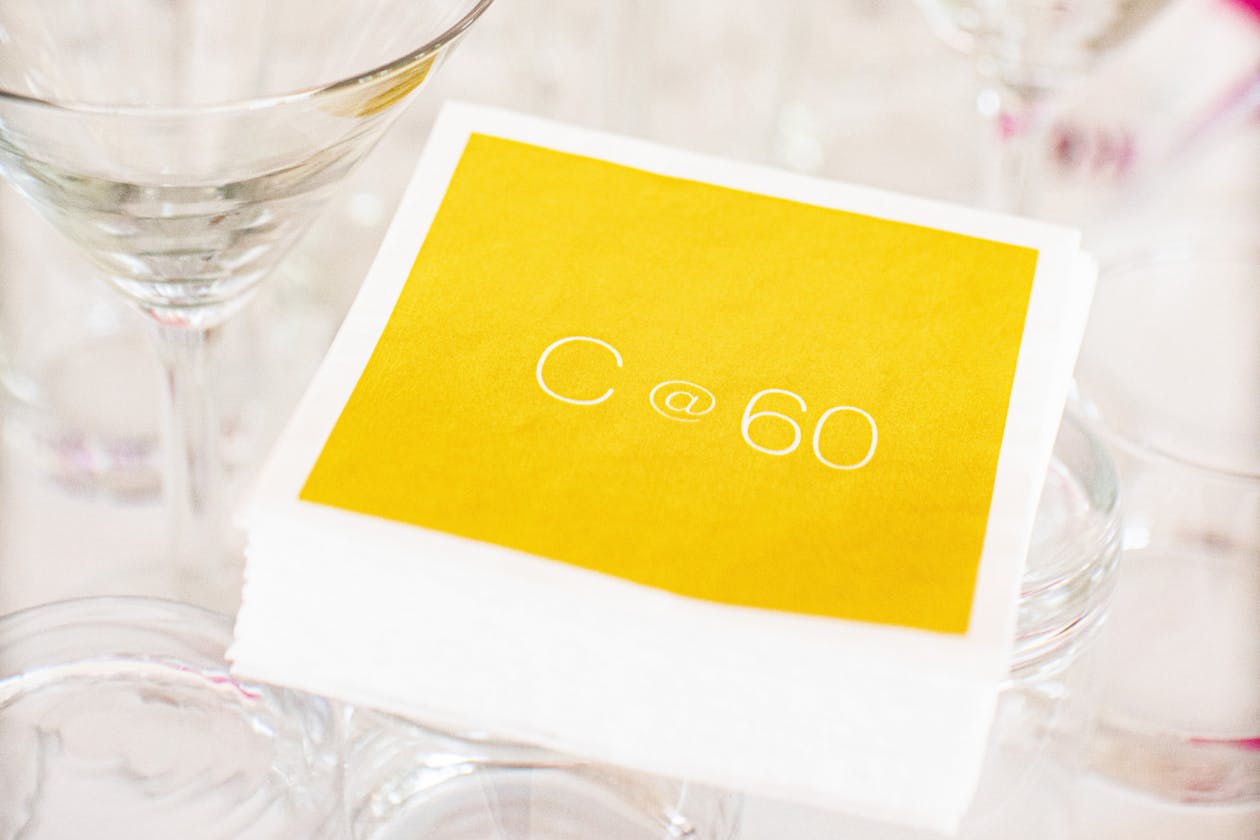 personalized 60th birthday napkins in yellow | PartySlate