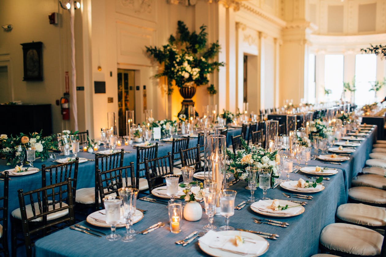 Indoor wedding with gray-blue table linen | PartySlate