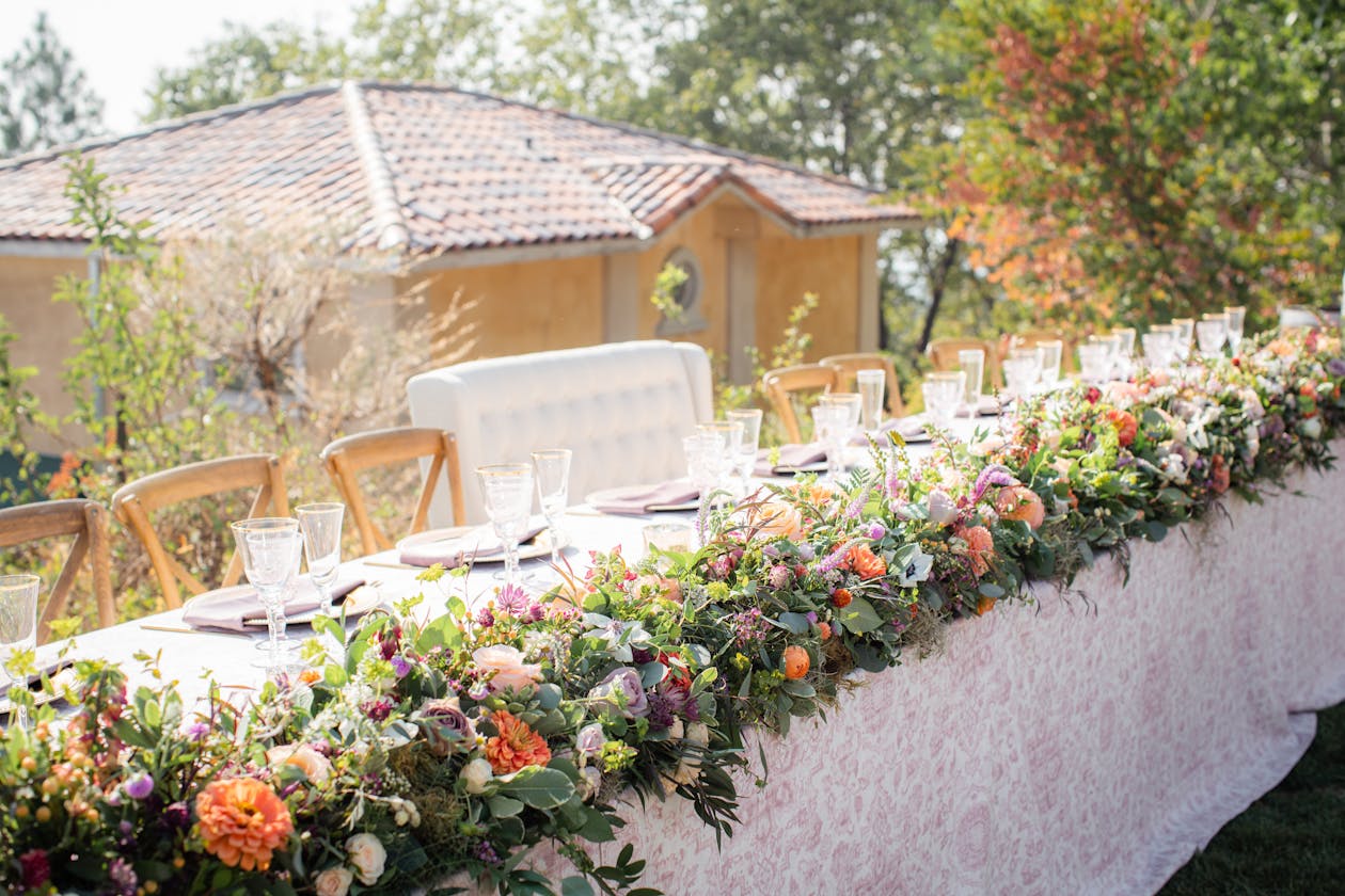 Outdoor wedding with wildflower table runner | PartySlate