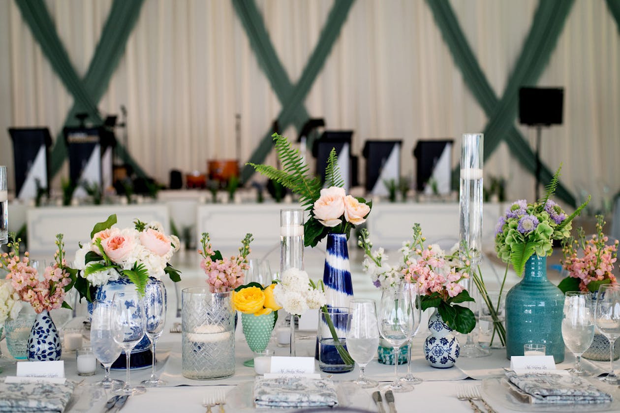 Summer wedding with blue table vases | PartySlate