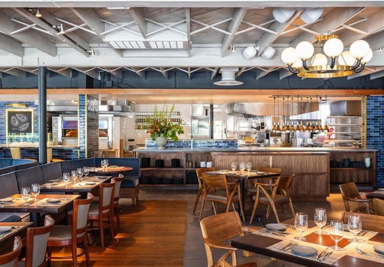 Bludorn restaurant in houston with private dining space and exposed industrial ceilings and exposed kitchen area | PartySlate