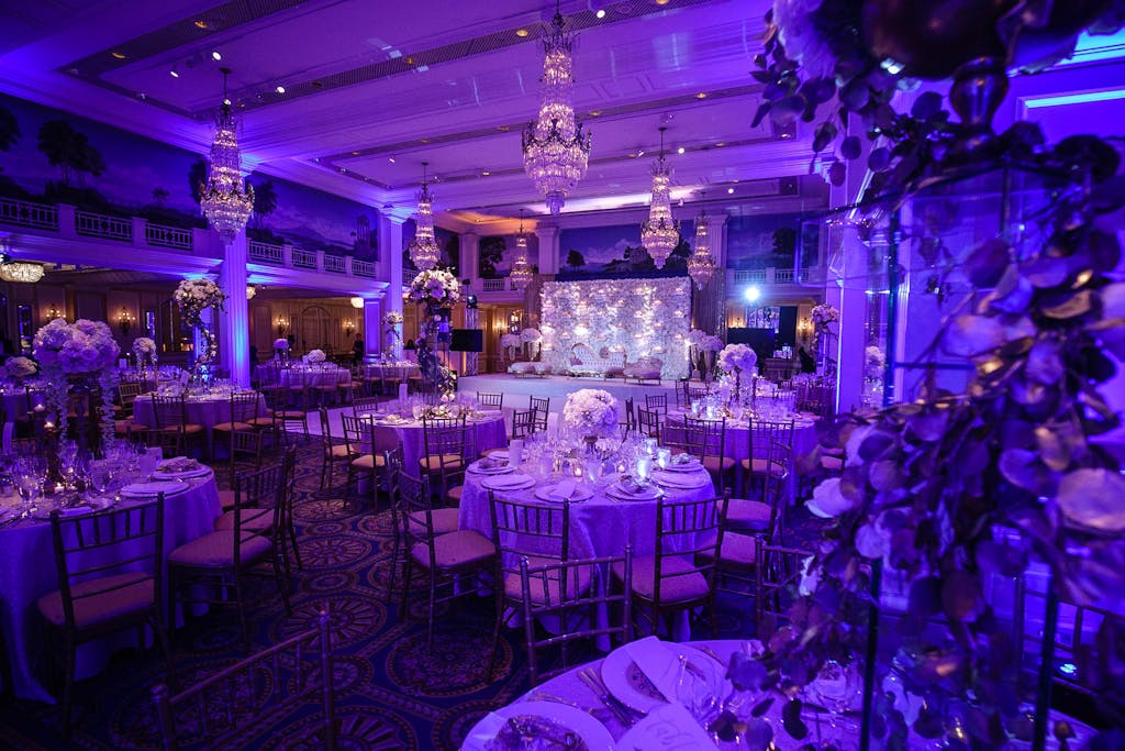 Elegant Hindu Catholic Wedding Reception with Purple Uplighting at Willard Intercontinental in Washington, DC