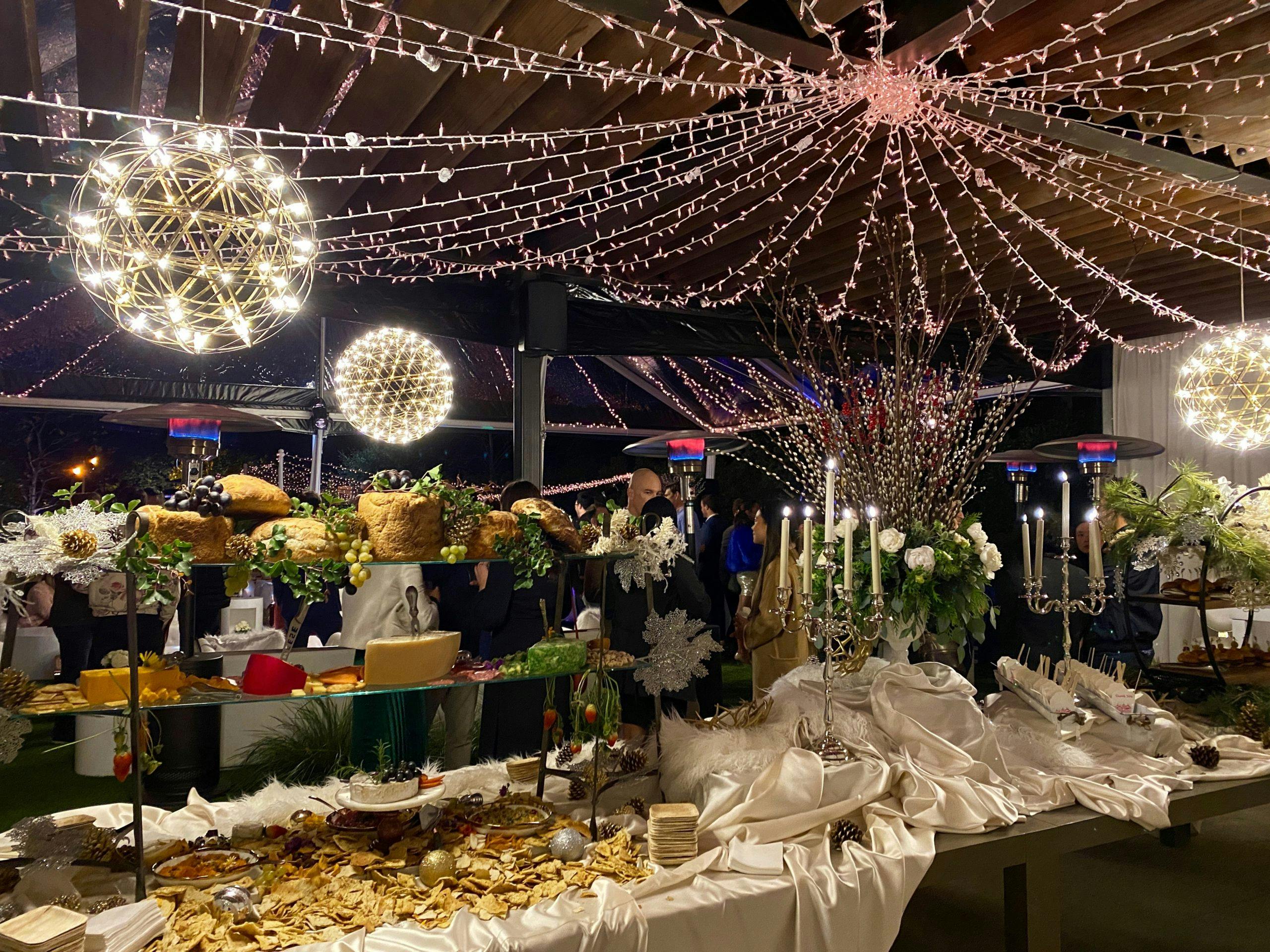 Tented holiday party venue with string lights | PartySlate