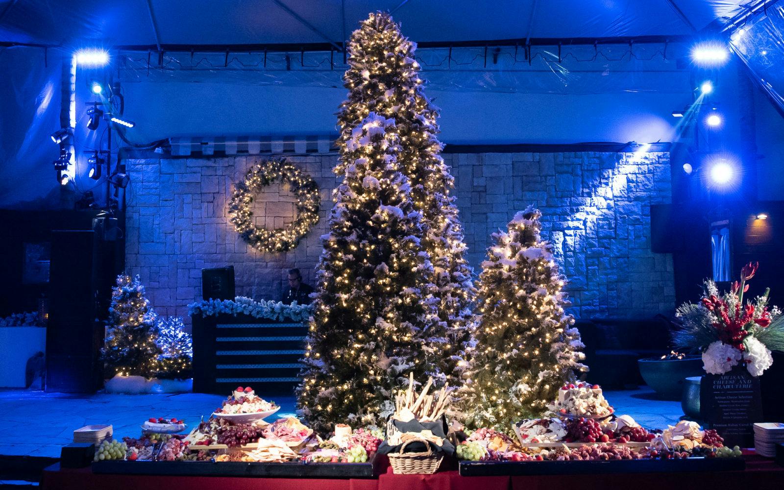 Warner Music Holiday Party with winter evergreen décor.