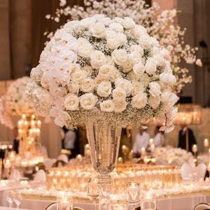 White floral wedding centerpiece at romantic wedding reception.