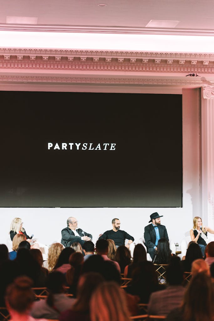Panelists discussing industry topics on stage