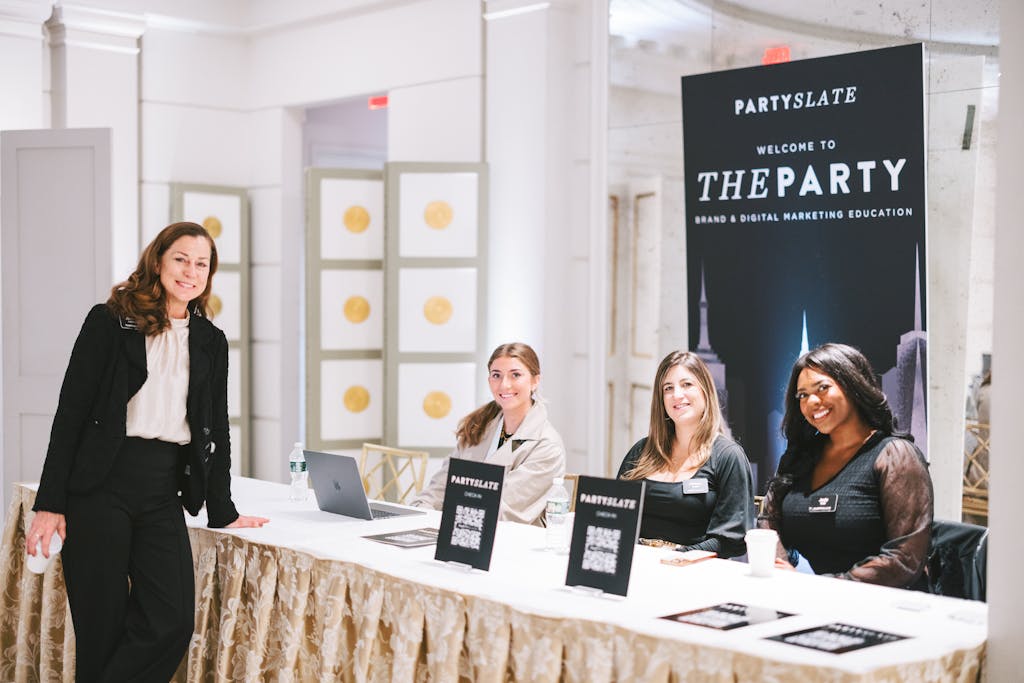 People working the welcome table at a party