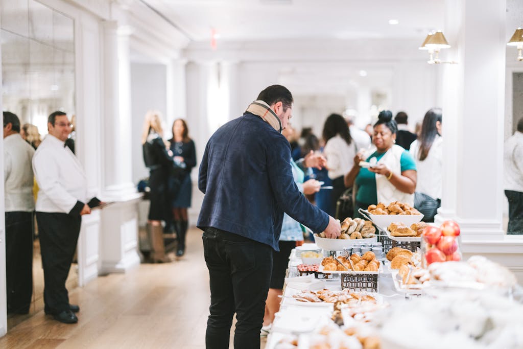 Man getting food at buffet table