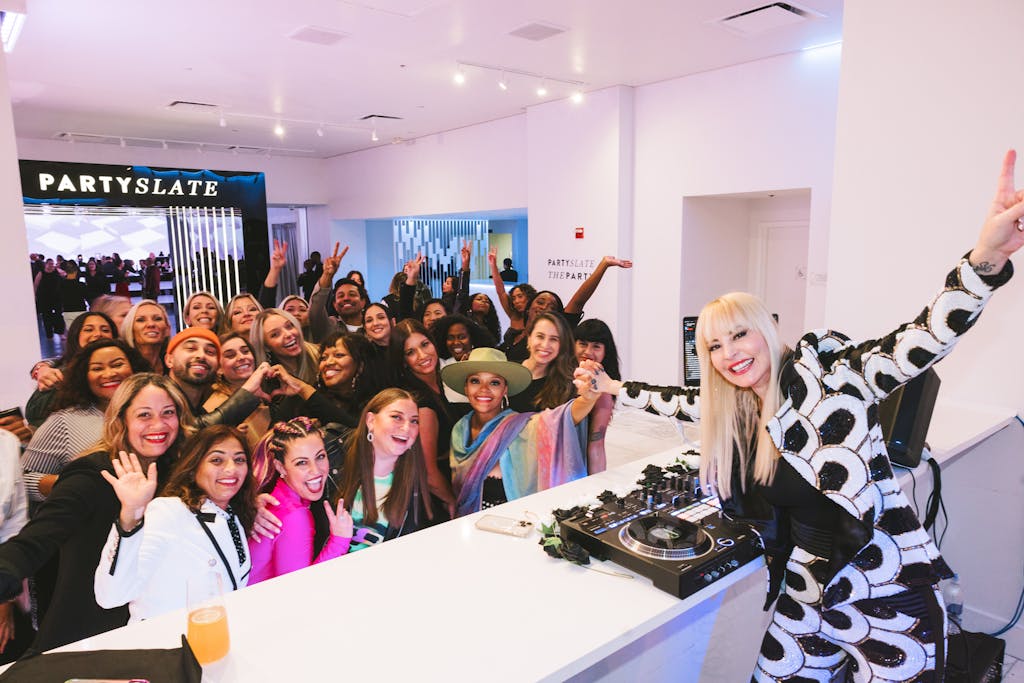 The DJ posing for a picture with the crowd