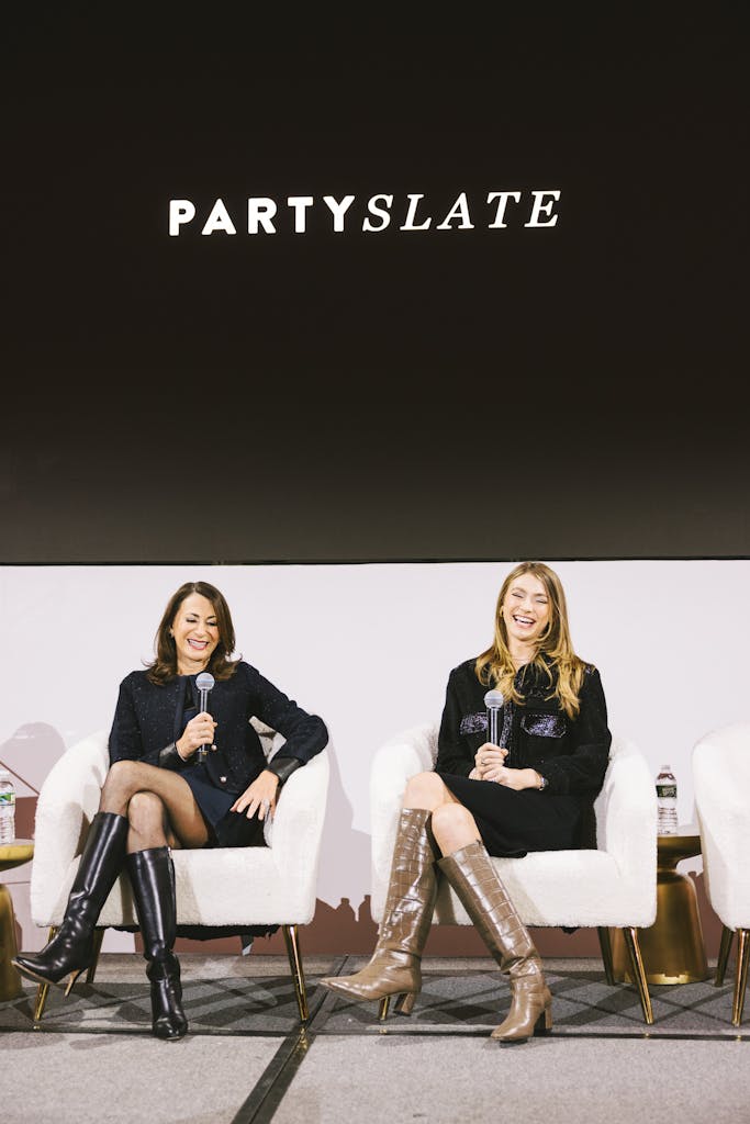 Two panelists speaking at a PartySlate event