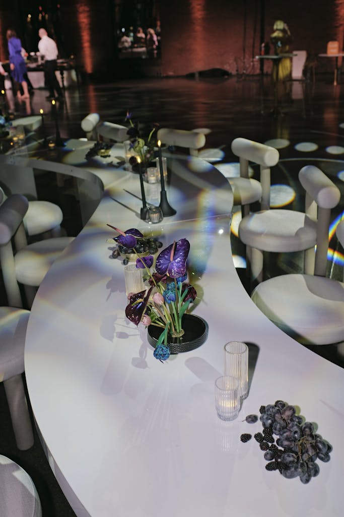 Monochromatic white tablescape with purple florals
