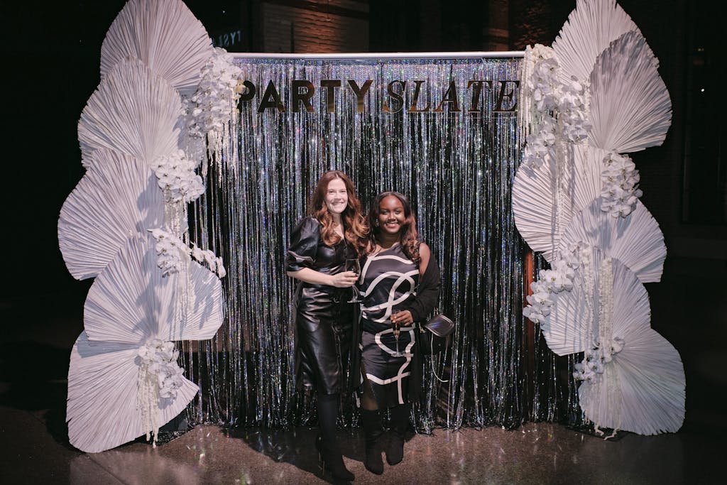 Two guests posing at the photo-op station